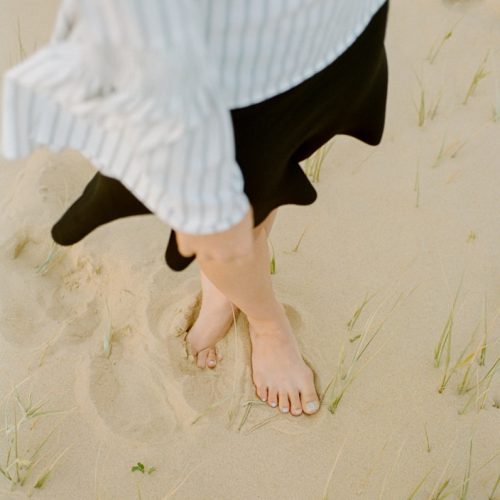 woman wearing white top and black skirt